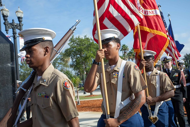 Marines carrying flags at Memorial Day 2026 event