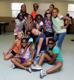 Photo of a bunch of kids posing at a summer camp