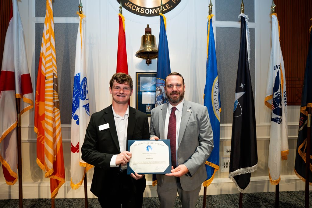 CP Kevin Carrico pictured with Page Program participant Wyatt Brown following the certificate presentation at the City Council meeting in the City Council Chamber, Jacksonville, FL.