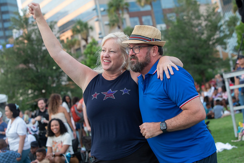 Man and woman enjoying a concert on July 4th celebration