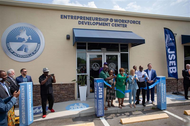 ribbon cutting in front of building