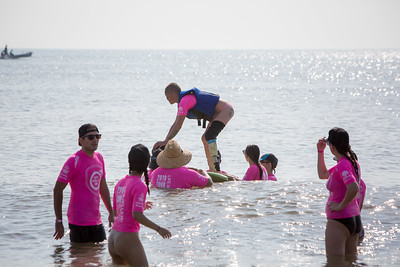 Image of people adaptive surfing