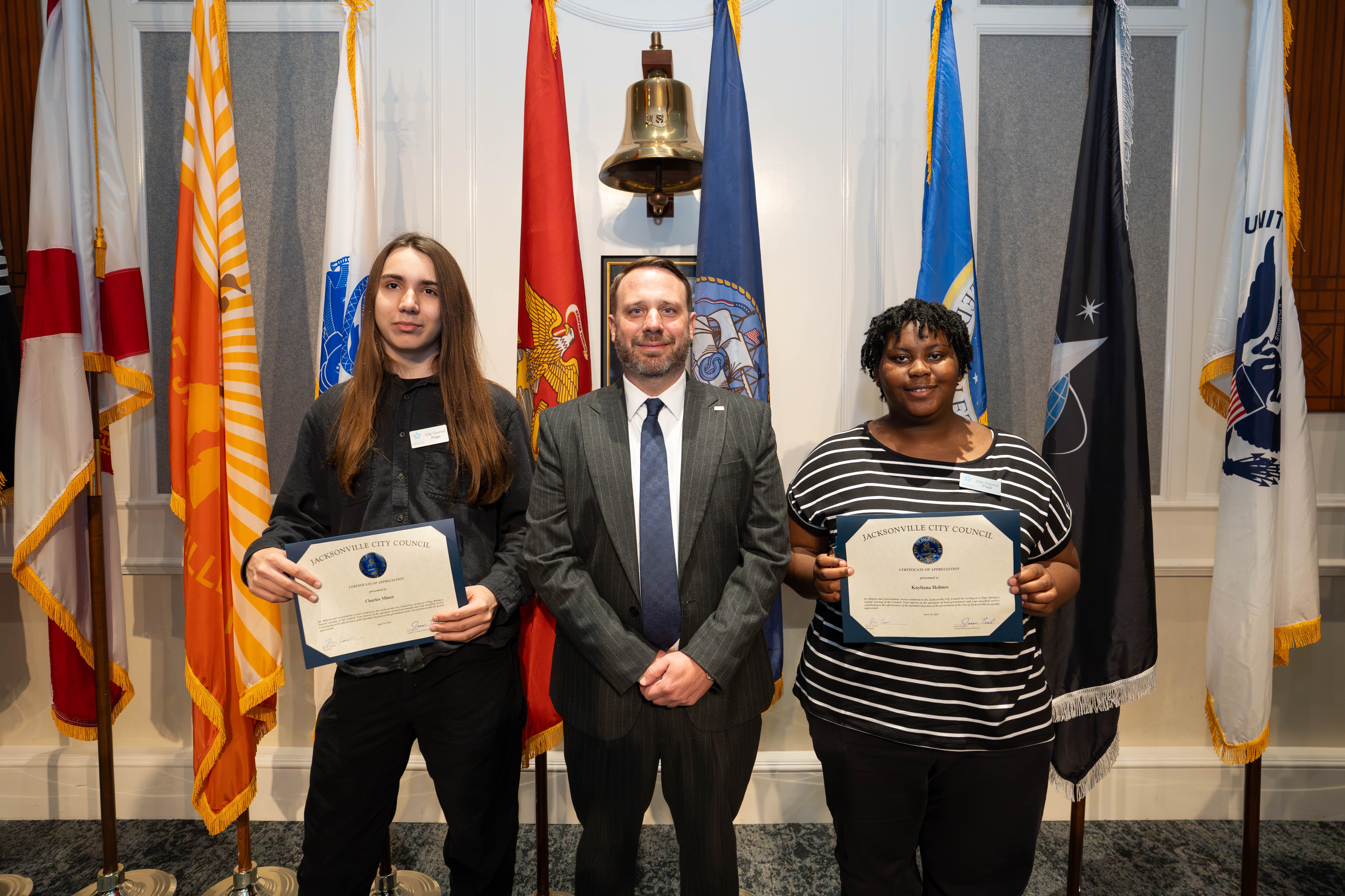 CP Kevin Carrico pictured with Page Program participants Charles Minor and Kayliana Holmes following the certificate presentation on April 14, 2026 at the City Council meeting in the City Council Chamber, Jacksonville, FL.
