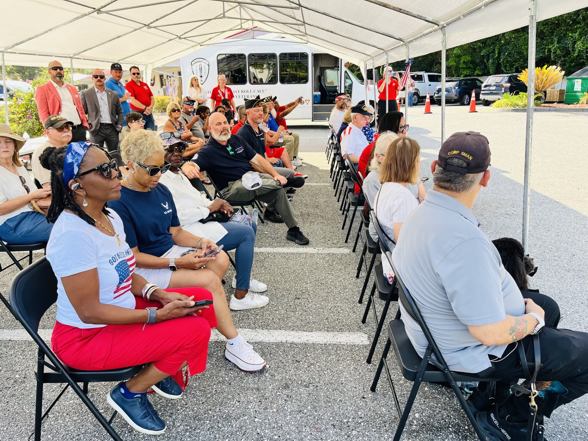 People under tent at the beginning of the 250 Flag Retirement Ceremony taking place at American Legion 283