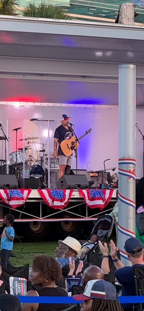 Sal Gonzalez preforming with a guitar at Freedom Fest 250