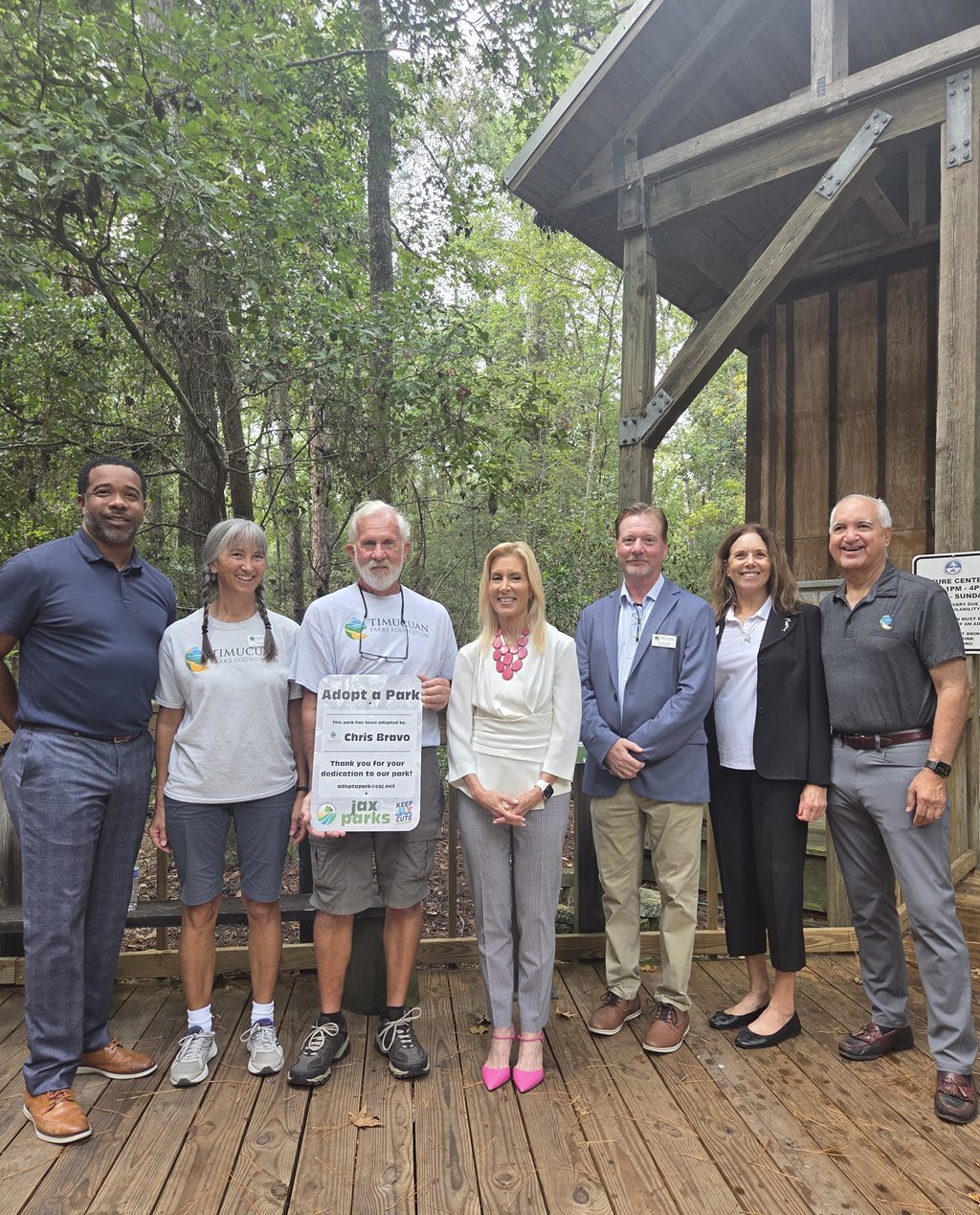 Lots of people standing, talking and viewing renderings