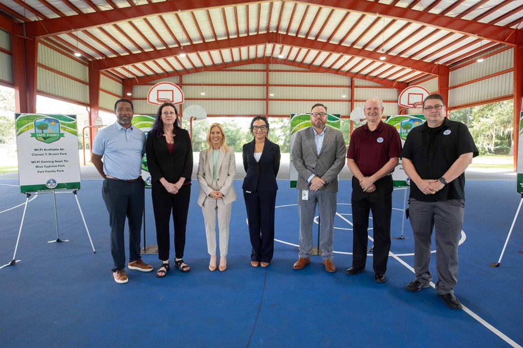 group of people posing in aa line