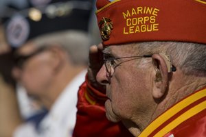 Veterans saluting at the Veterans Memorial Wall
