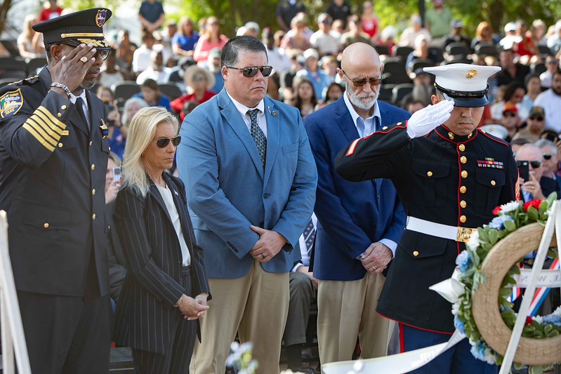 Mayor Deegan, Sheriff T.K. Waters and representative from JP Morgan, Marine showing respect at the laying of a wreath at Memorial Day 2026 service