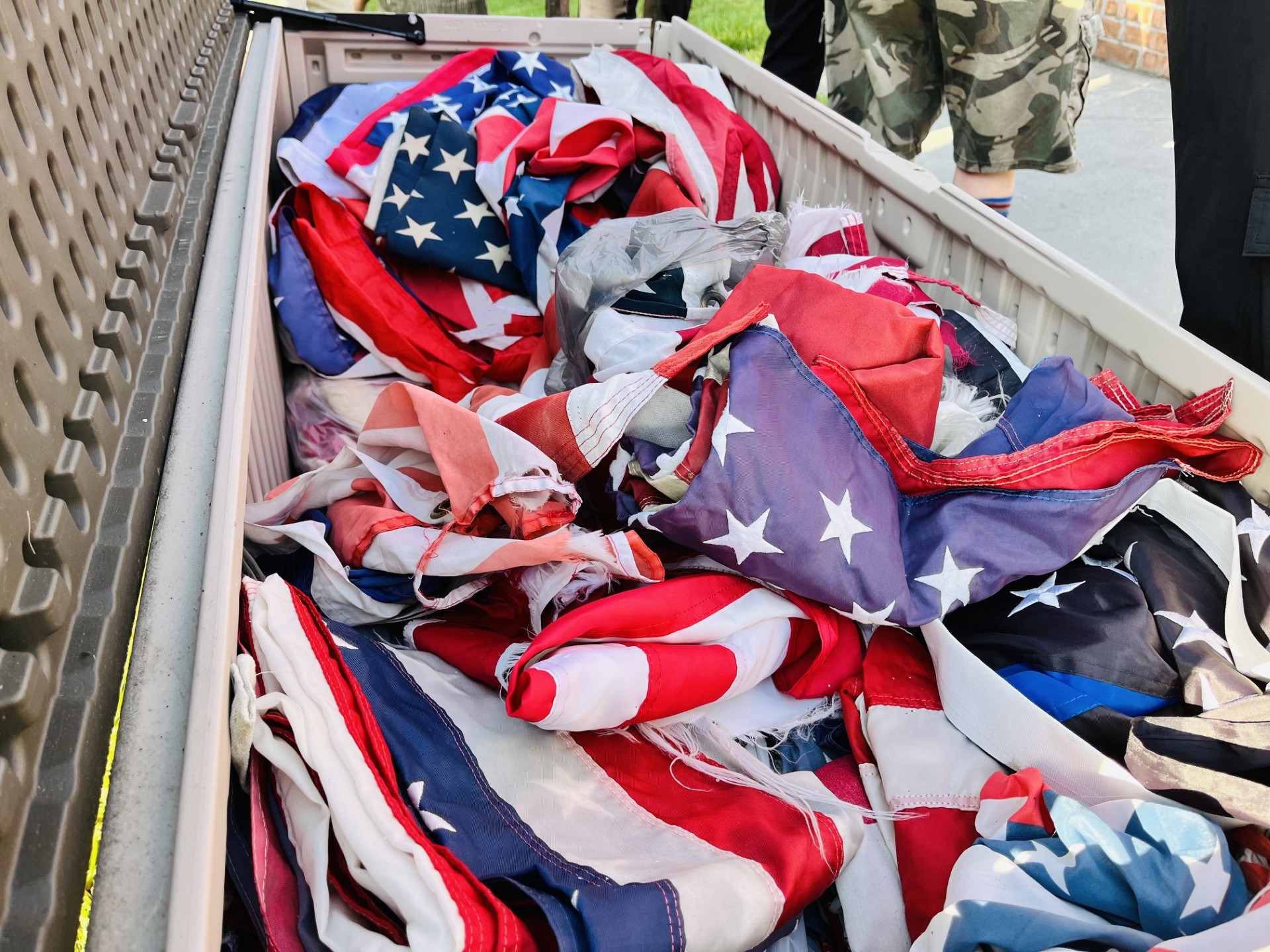 Flags that are being prepared to be respectfully retired at the 250 Flag Retirement Ceremony at American Legion 253
