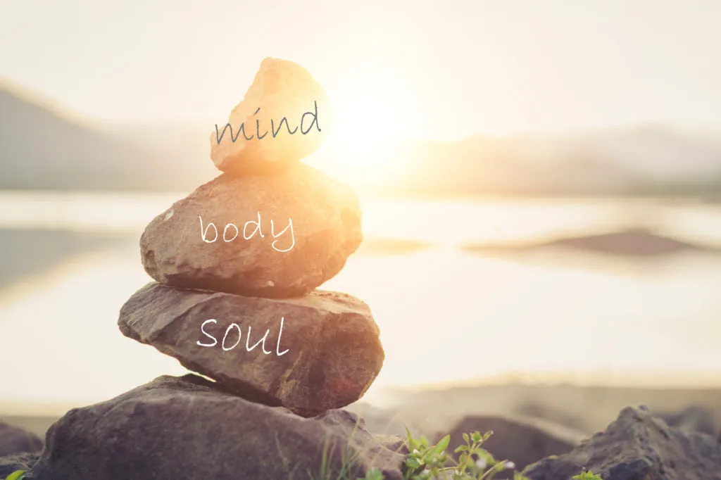 Zen stones with written words mind, body and Soul