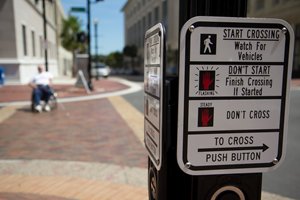 Photo of an audible pedestrian signal sign