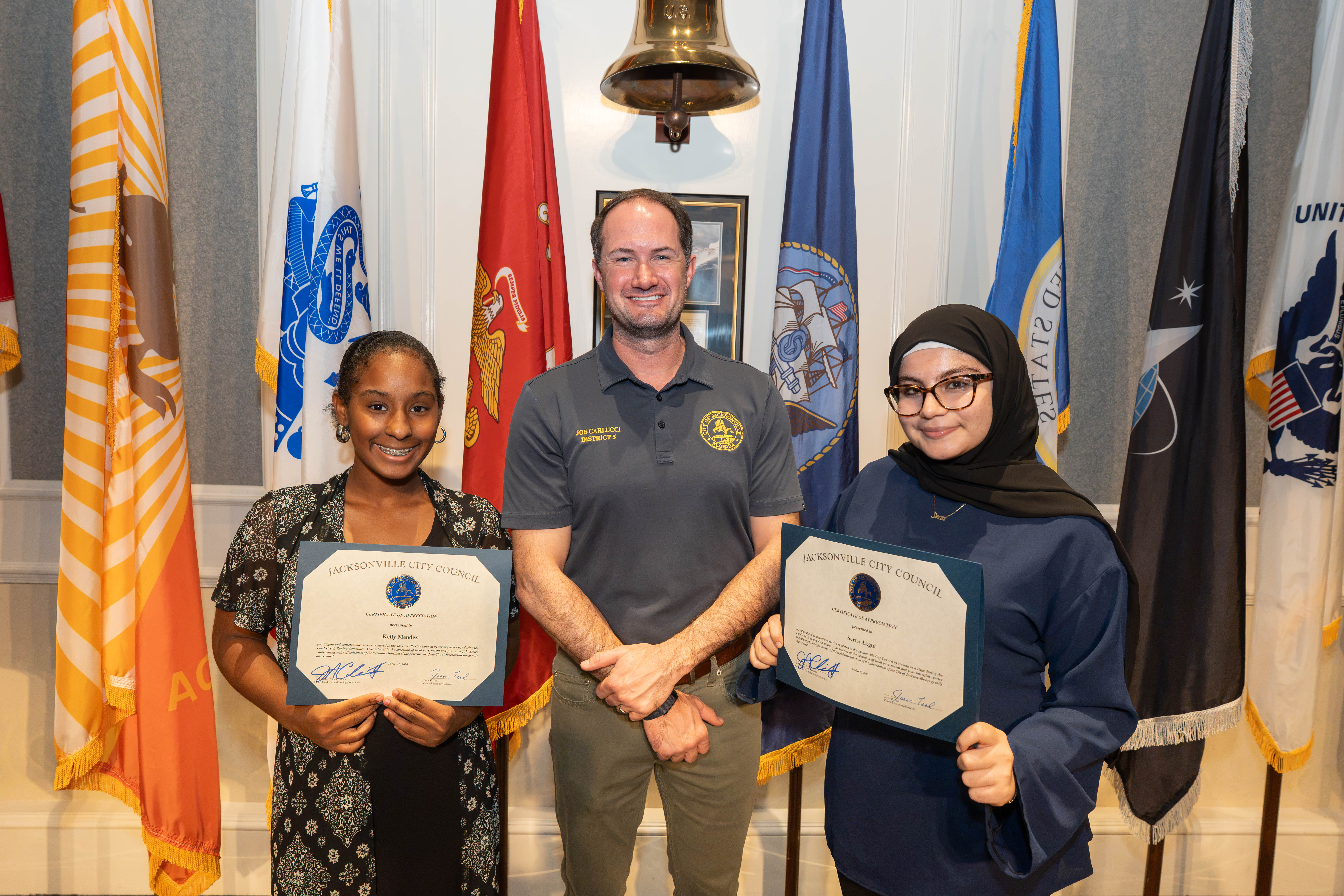 Page Program participant Kelly Mendez, CVP Joe Carlucci, Page Program participant Serra Akgul, on October 6, 2026, at the LUZ Committee Meeting.