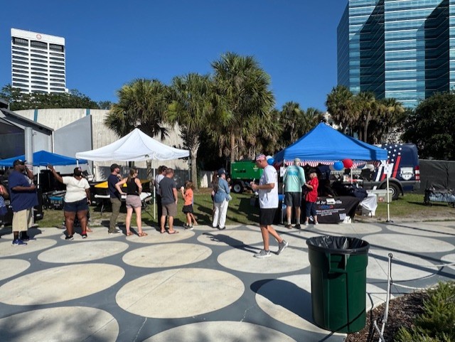 Freedom Fest people lining up for the free Apple pies City of Jacksonville Military Affairs and Veterans Department was giving away.