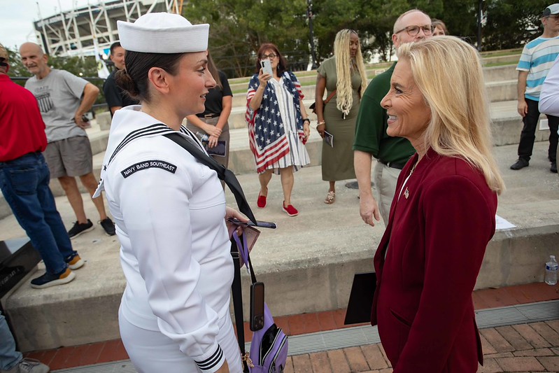 Mayor Donna Deegan and a sailor speaking after the Purple Heart Ceremony 2026