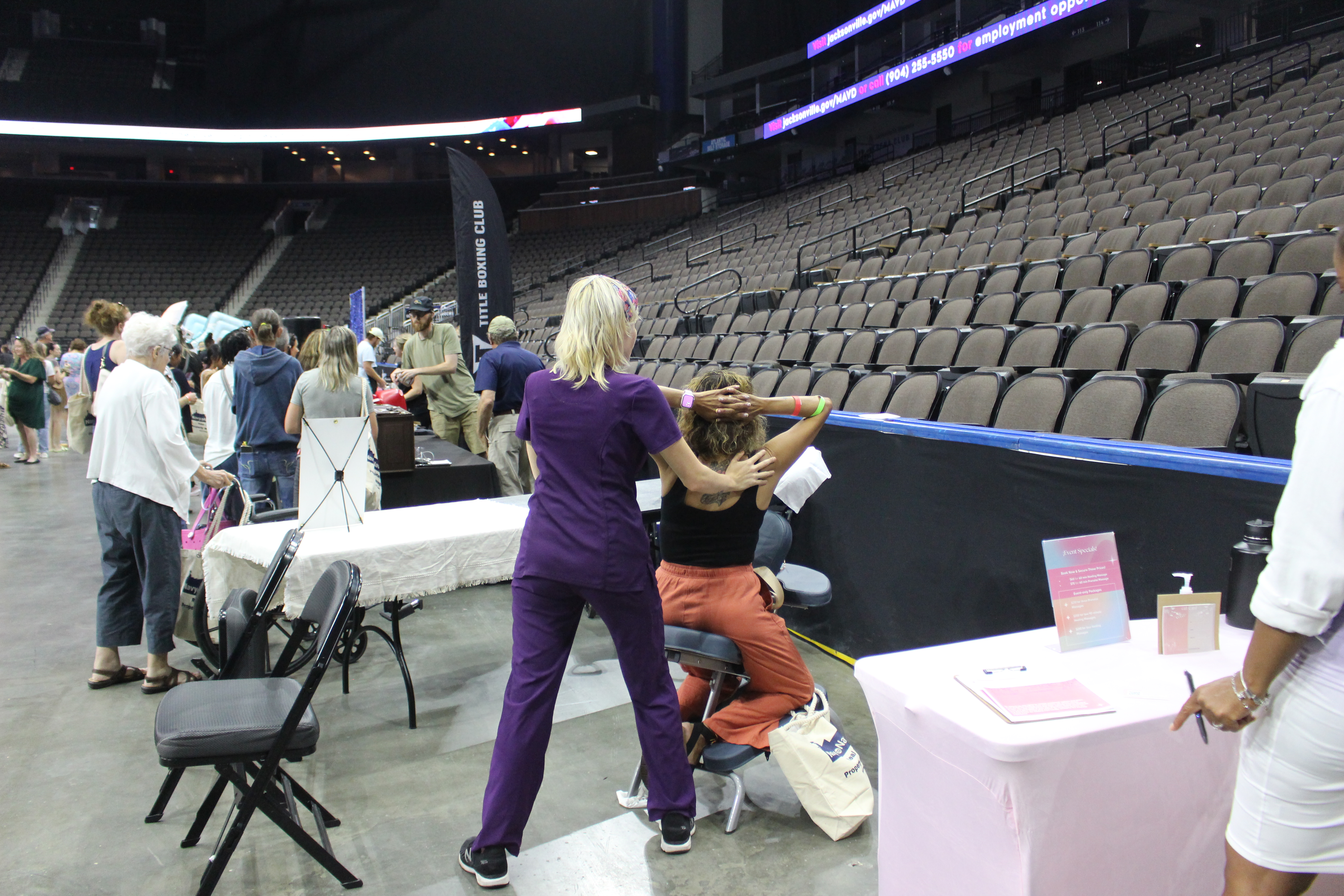 A spouse enjoying a massage at Spouses Night Out 2026