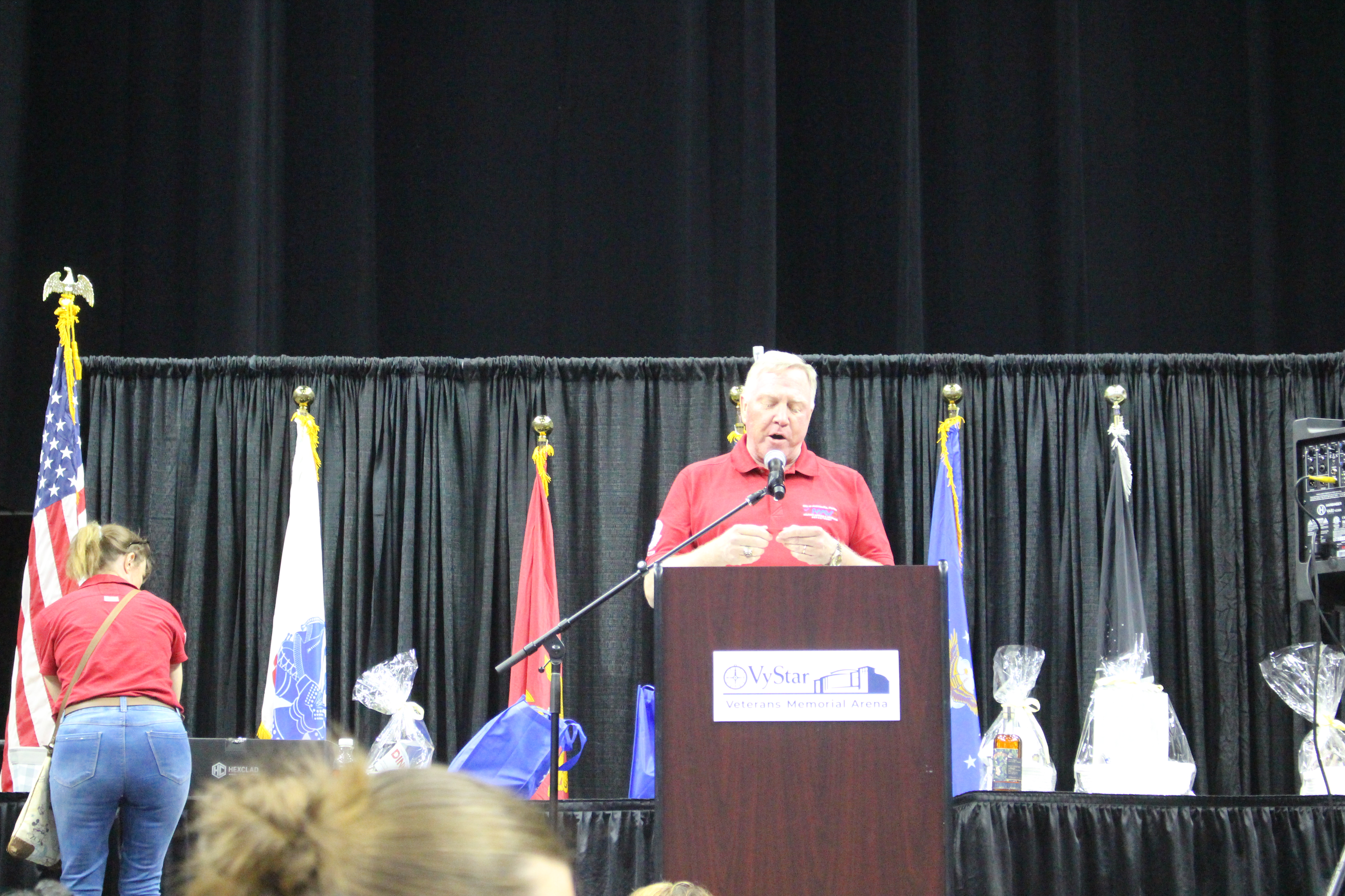 Director Harrison Conyers of COJ MAVD making announcements and calling winning numbers for the prizes
