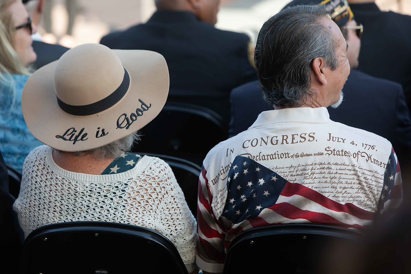 Man and Woman sitting in chairs at Memorial Day 2026 service