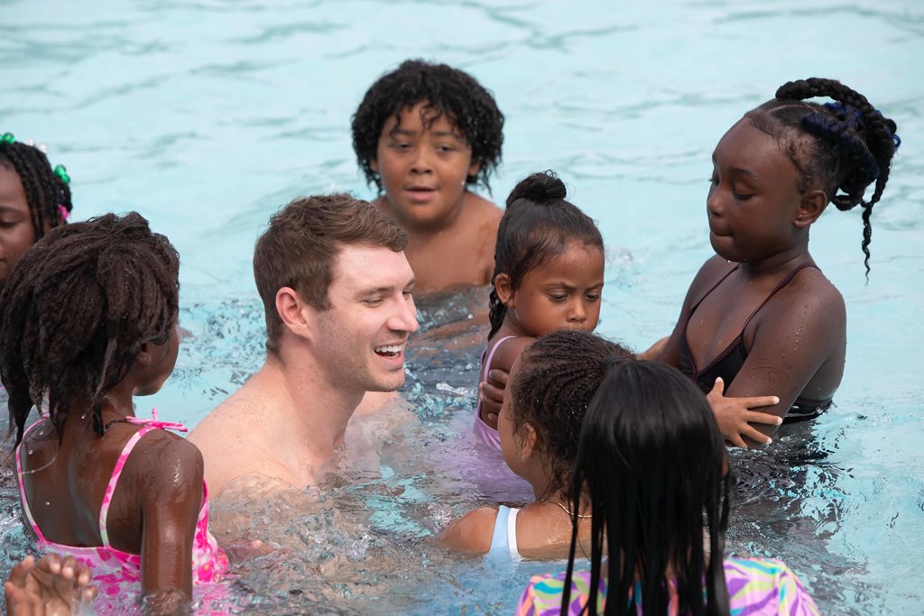 five-time Olympic gold medalist Ryan Murphy and kids swim in pool