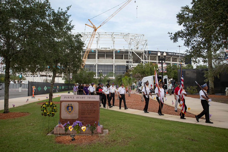 Flags being carried by American Legion Post 197 on the Purple Heart Trail walk during the Purple Heart Ceremony 2026