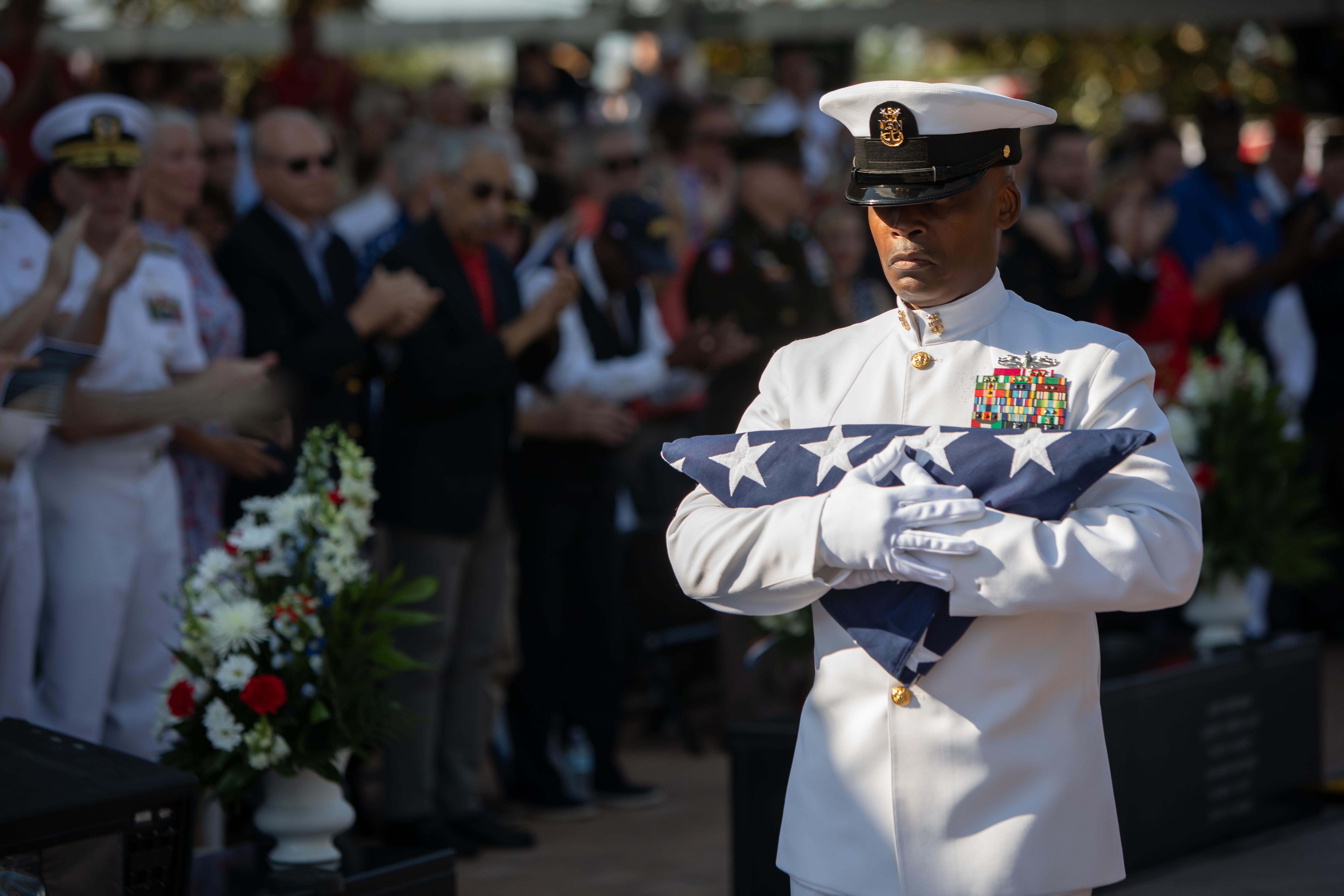 man carrying flag 