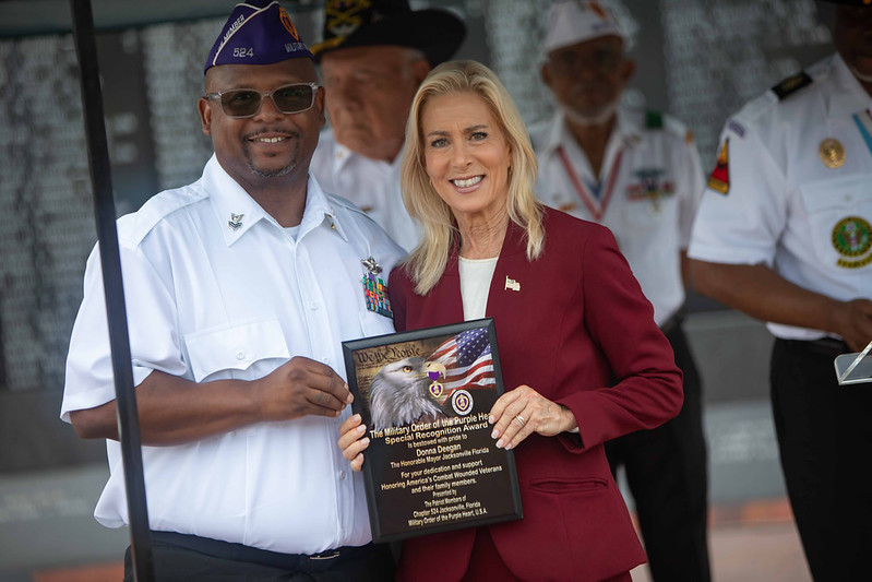 Mayor Donna Deegan receiving award from MOPH Chapter 524 members during the Purple Heart Ceremony 2026