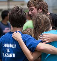 Image of a people in a group hug