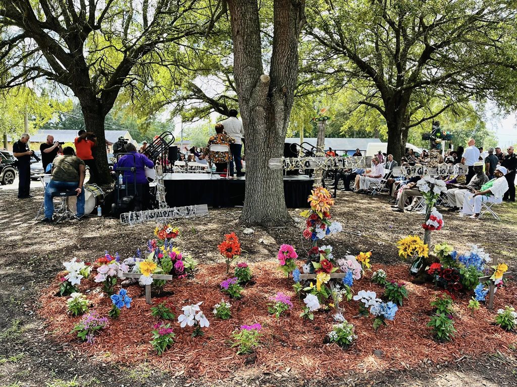 Memorial with flowers and wreathes to honor victims