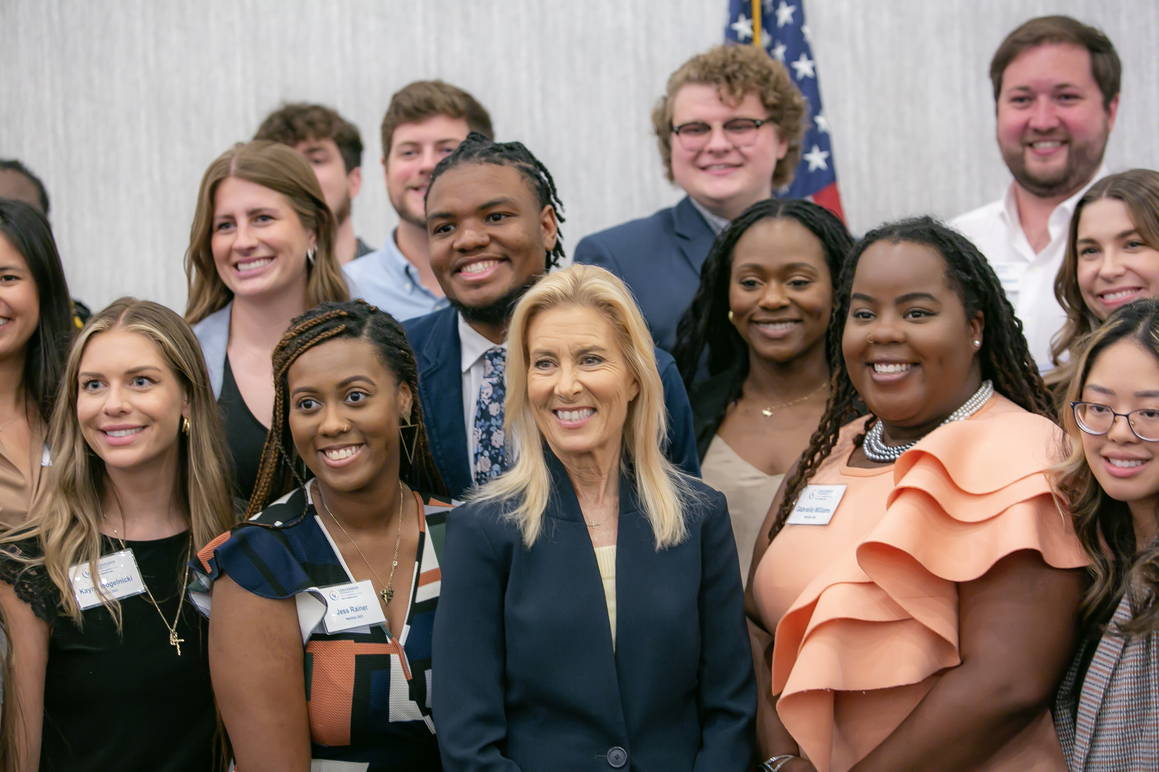 Mayor deegan poses with attendees of Meninak luncheon