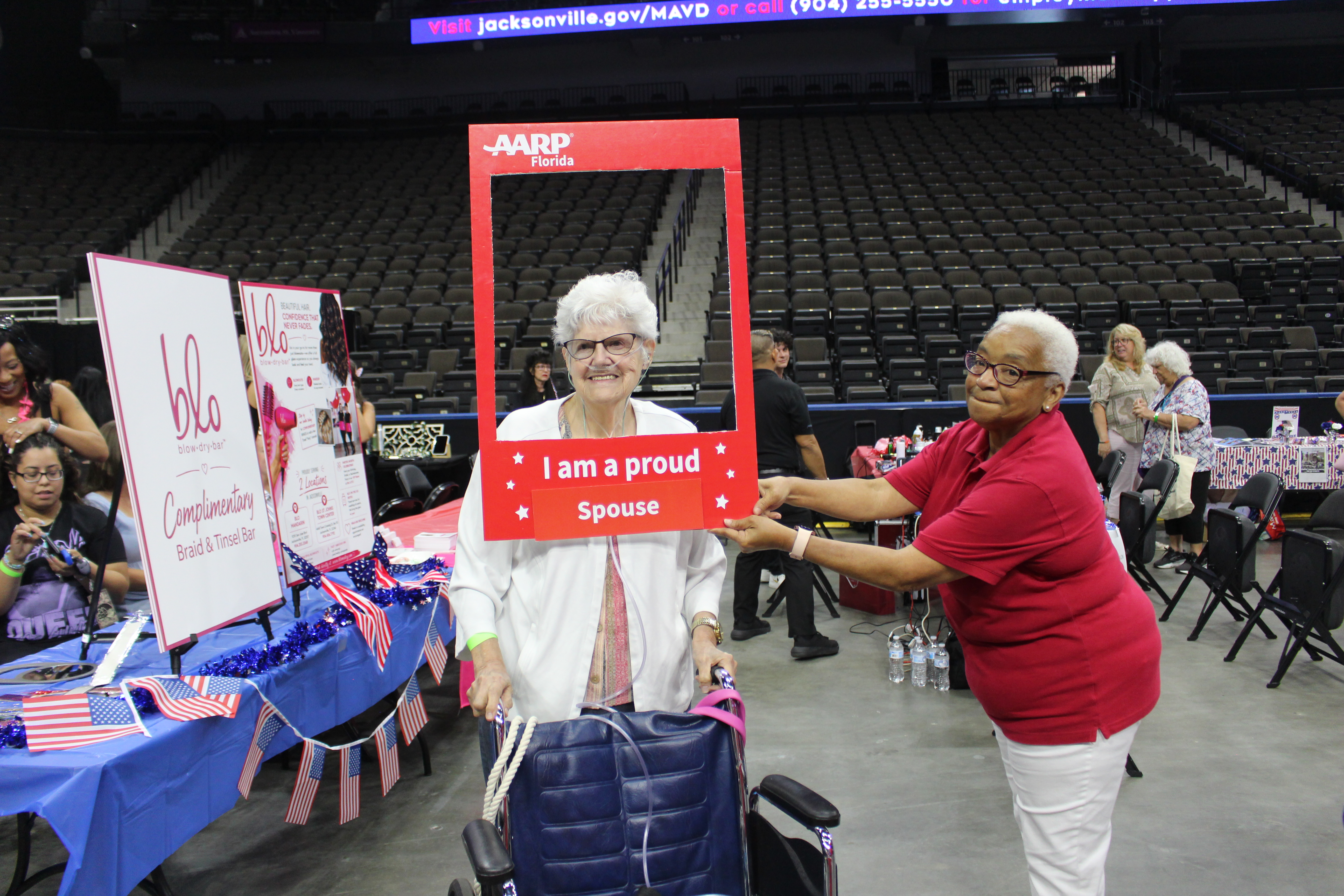 AARP representative helping take some photos of spouses at Spouses Night Out 2026