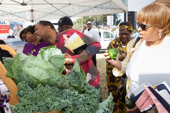 Members of The Bethel Church's congregation looking over the offerings at the City's first Farm to Faith Produce Sale on Sunday, Feb. 21, 2016. 