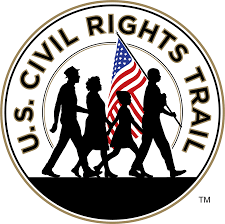 Civil righst trail logo with silhouettes of people walking and holding American flag