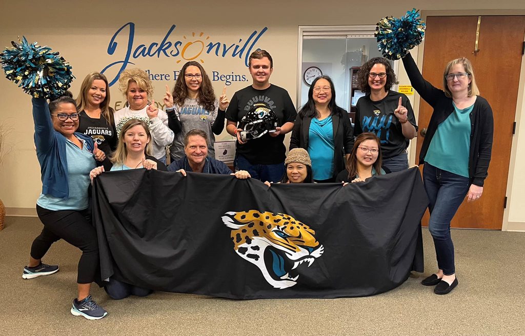 City employees wearing Jacksonville Jaguars gear