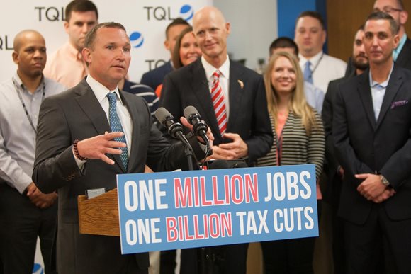 Mayor Curry speaking with Governor Scott at a recent news conference recognizing TQL.
