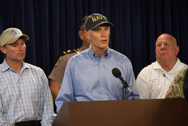 Governor Rick Scott standing at podium during press conference