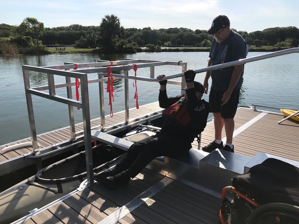 kayak launch at hanna park with someone loading and someone watching for support