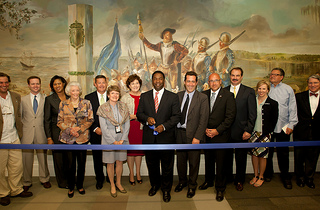 Photo of the ribbon cutting ceremony for artist Lee Adams' 30-foot mural titled 
