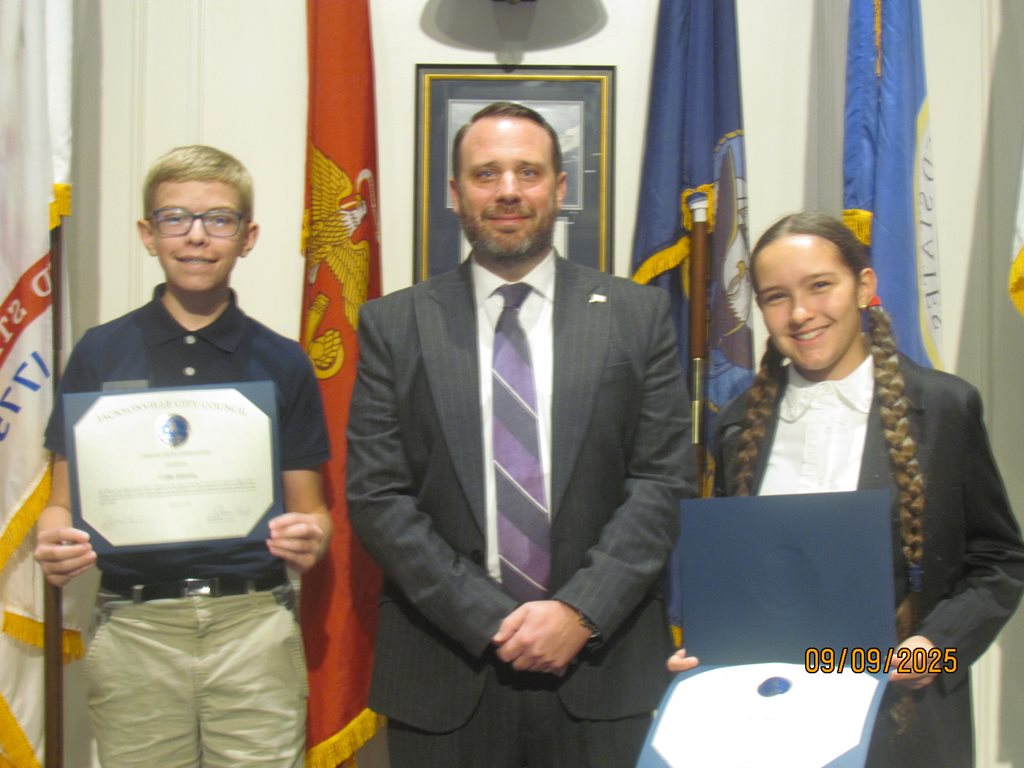 Collin Johnson, CP Carrico, and Emily Caldwell on September 9, 2025 at the City Council meeting. Summary: CP Carrico with Page Program participants Collin Johnson and Emily Caldwell following the certificate presentation.