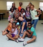 group of children posing wearing sunglasses