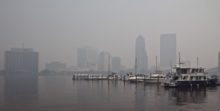Smoke hangs over the city of Jacksonville skyline.