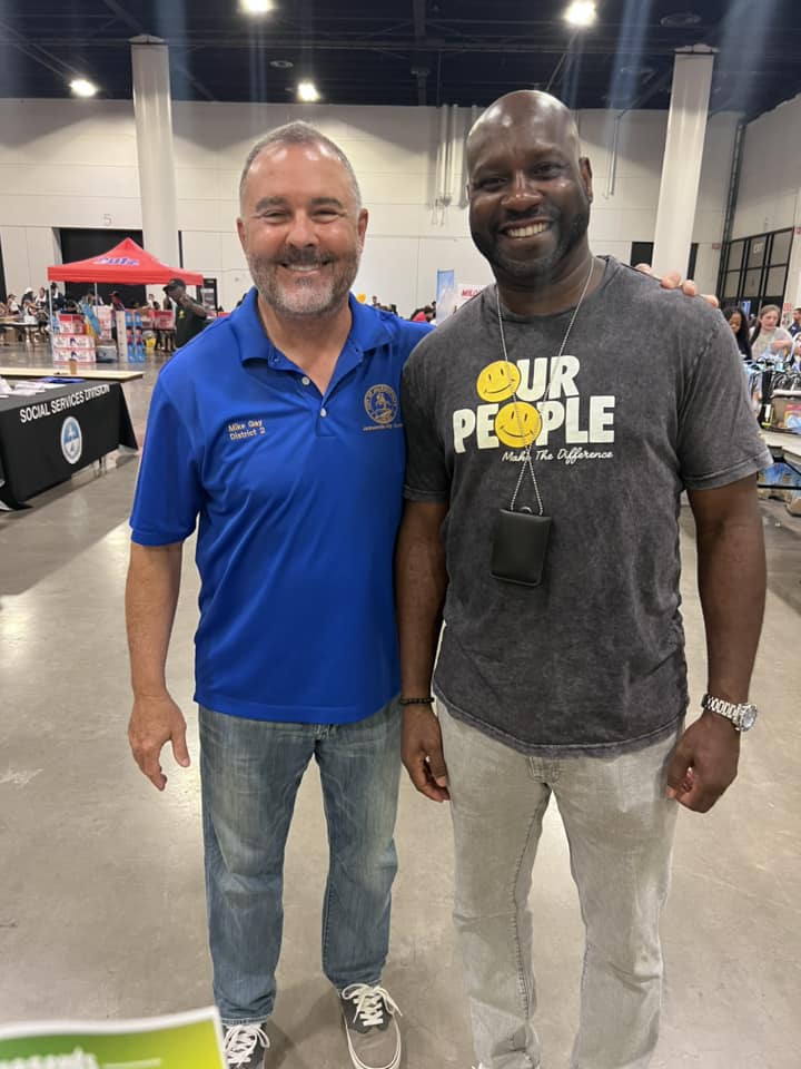 Council Member Mike Gay poses with Sedrick Utley, Marketing Manager of Walmart 