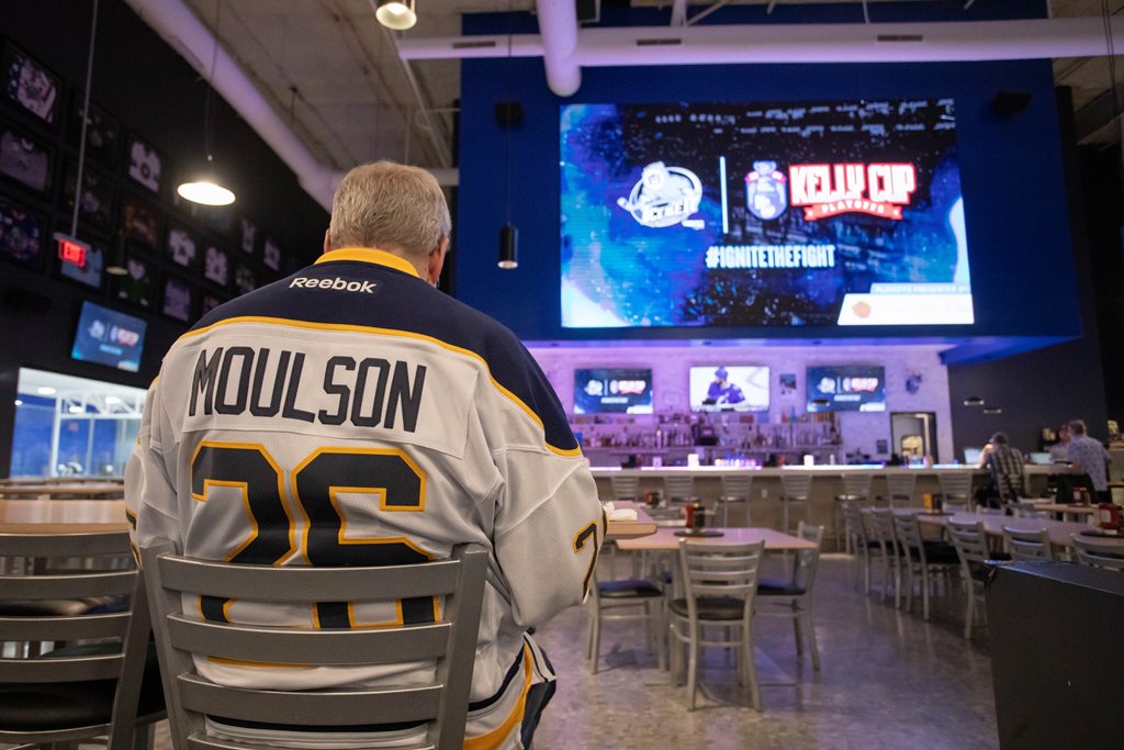 hockey fan wearing team jersey