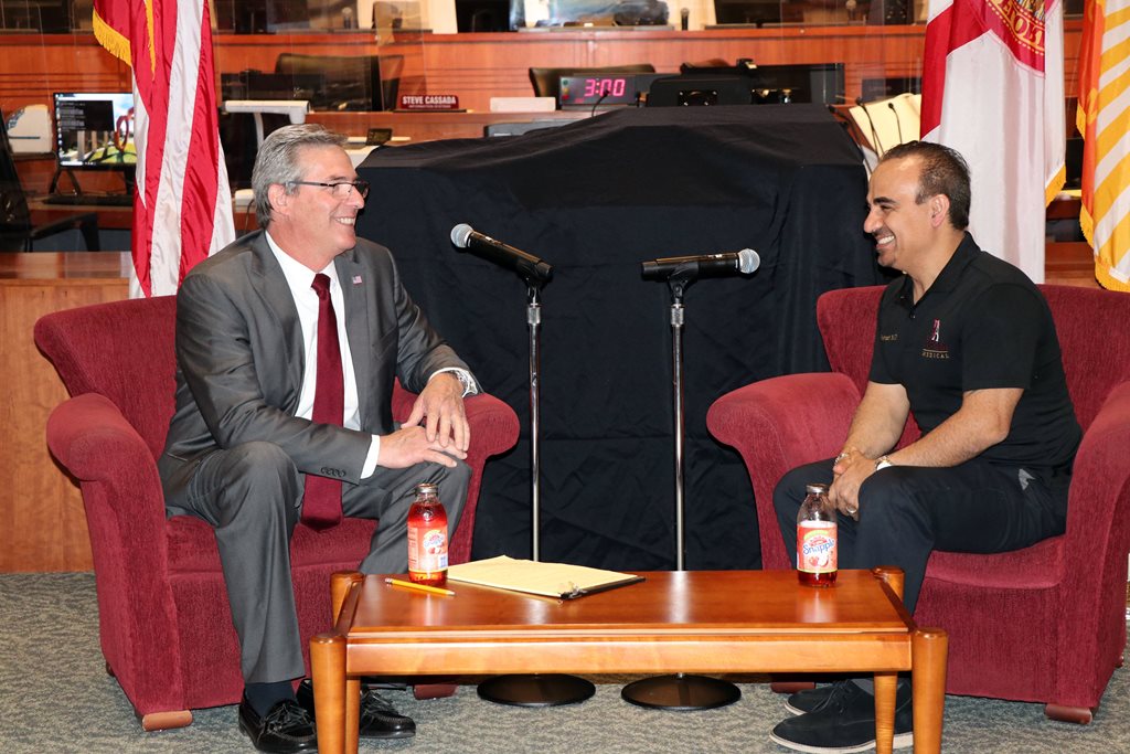 Photo of Council Member Al Ferraro interviewing Dr. Saman Soleymani.
