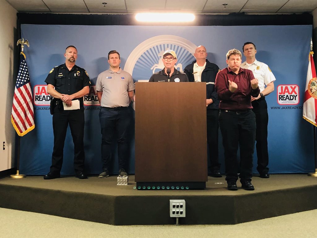 mayor and others behind podium for press conference