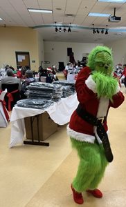 Celestine-Mills-as-the-Grinch-at-CM-Pittman-Holiday-Senior-Luncheon-December-14,-2023-Legends-Center.jpeg
