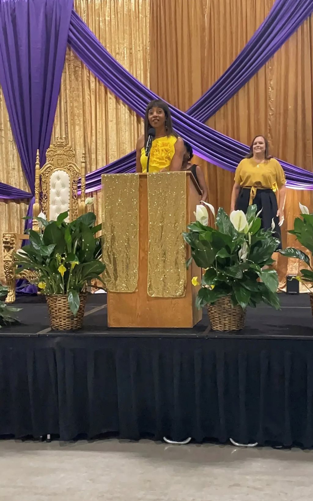 Clark-Murray speaking to over 700 seniors with Stacy Amparan in the background