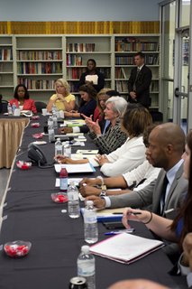 HHS Secretark Sebelius (center) speaking to a group of community stakeholders about the Affordable Care Act