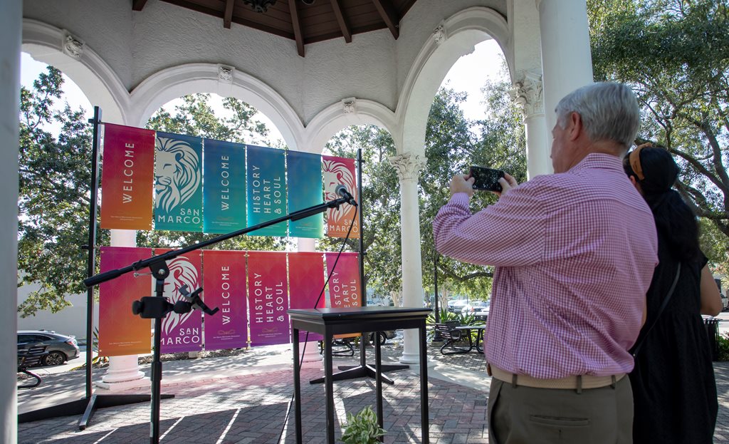 Banners read: “SAN MARCO” and “WELCOME” and “HISTORY, HEART & SOUL.” 