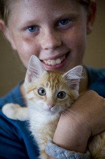 A happy pet with its new owner. 