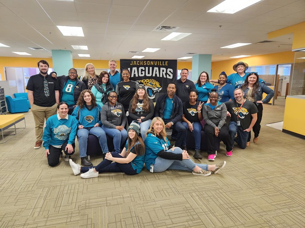 City employees wearing Jaguars football gear